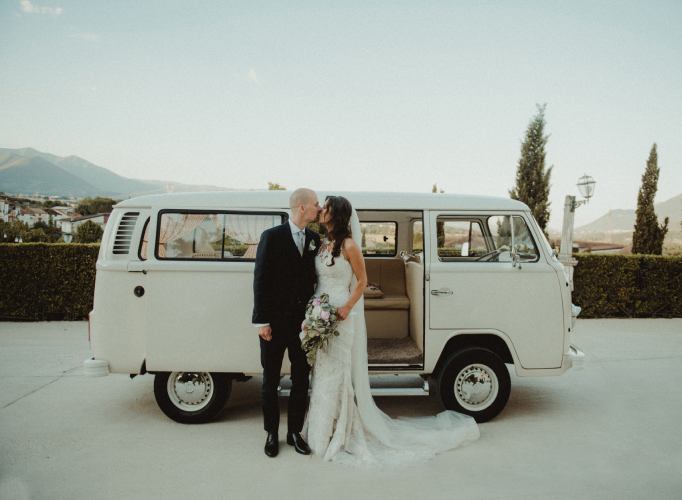 Bride and groom in monochrome VW van