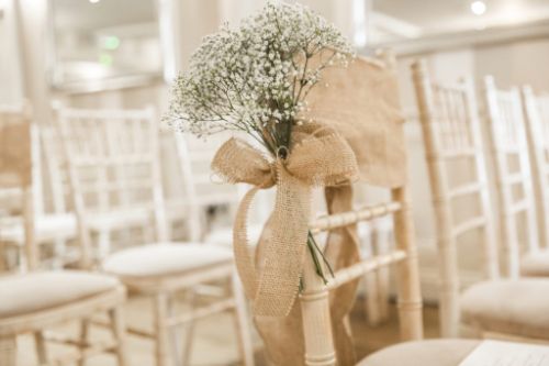 Rustic wedding ceremony pew ends decor