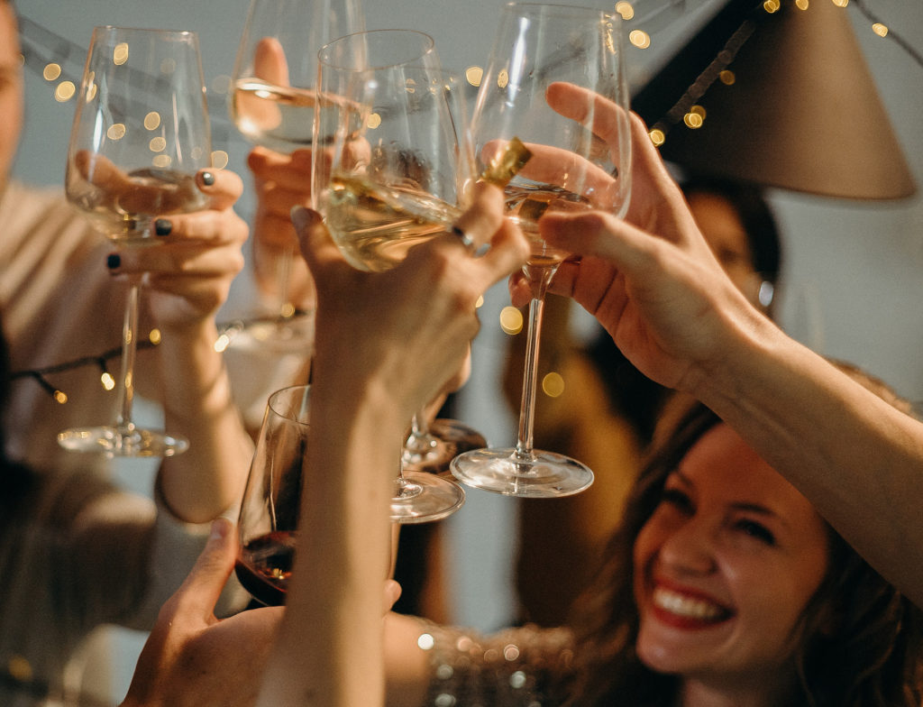 Women raising their glasses at a hen party