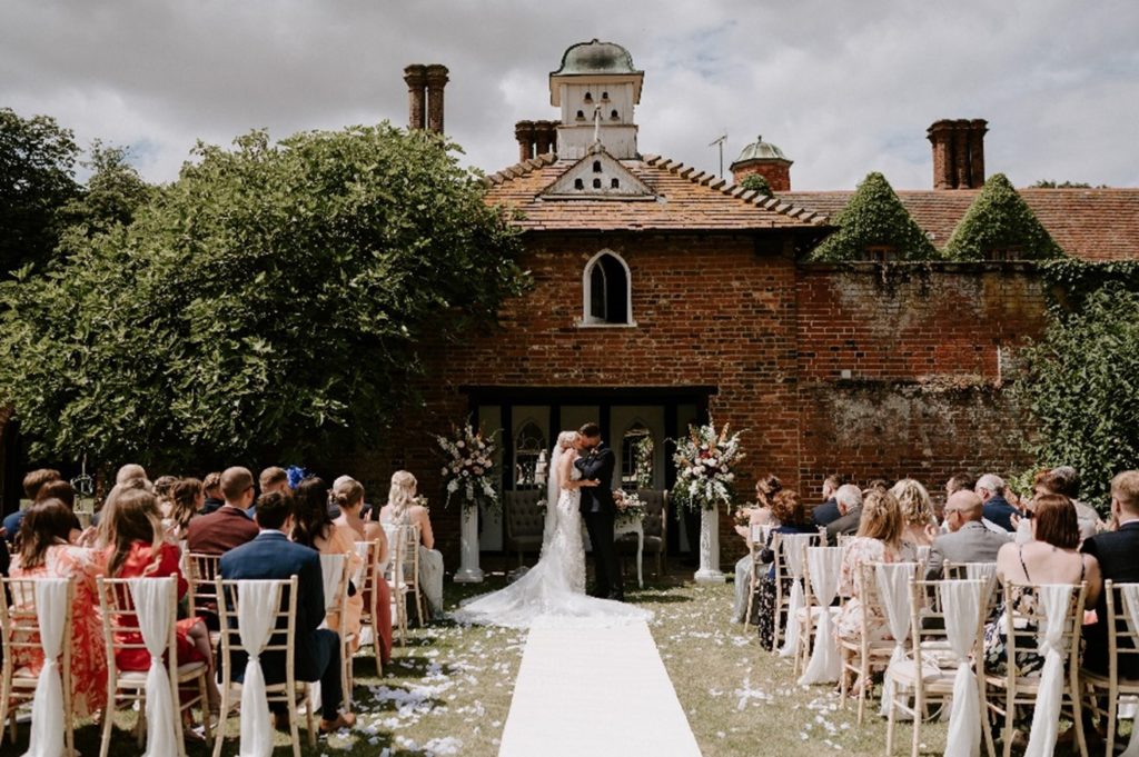 dovecote outdoor ceremony at woodhall manor